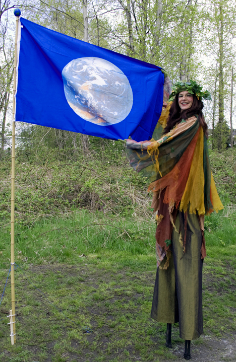 Foresta the Earth Goddess waves the Earth's flag at the Everett Crowley Park celebration, Earth Day 2009. PHOTO: E. Ayres
